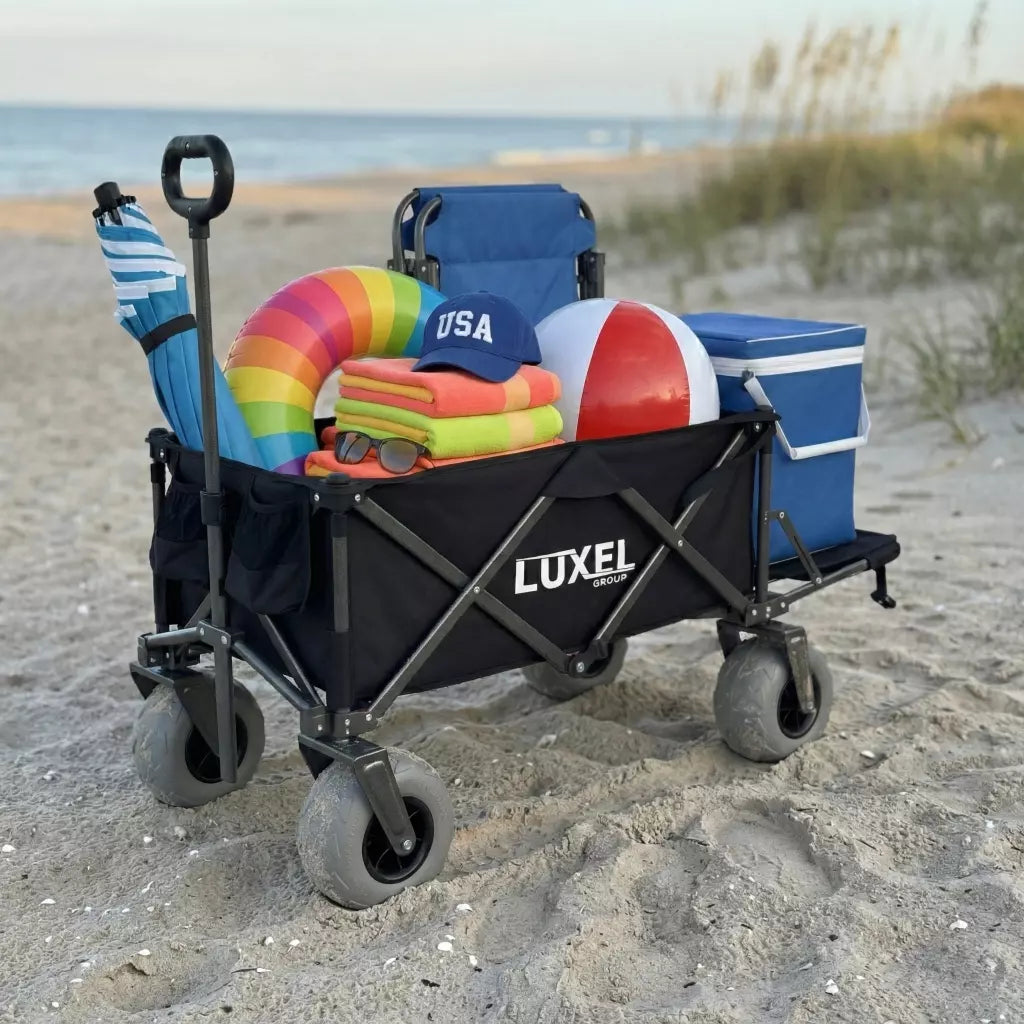 Luxel beach cart with beach gear on a sandy beach