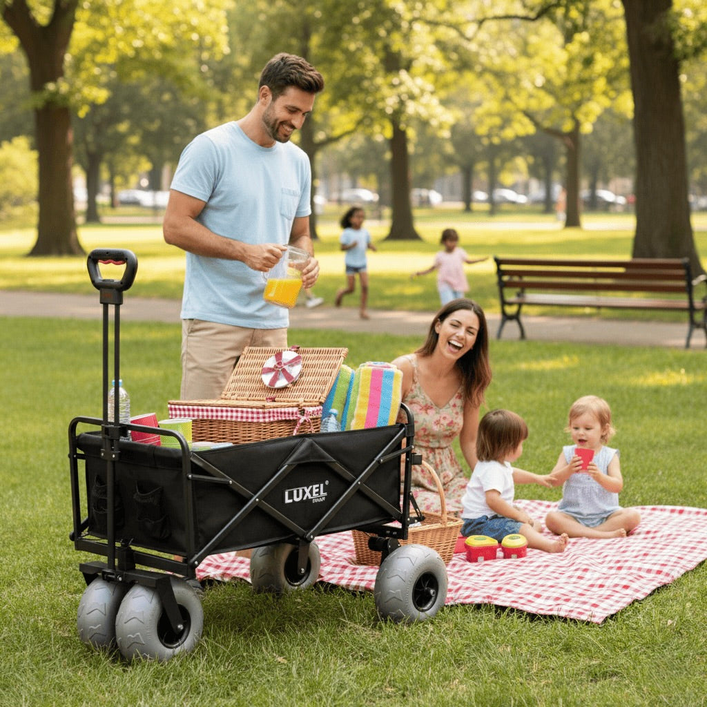 Family enjoying a picnic with a Luxe folding wagon in a park.