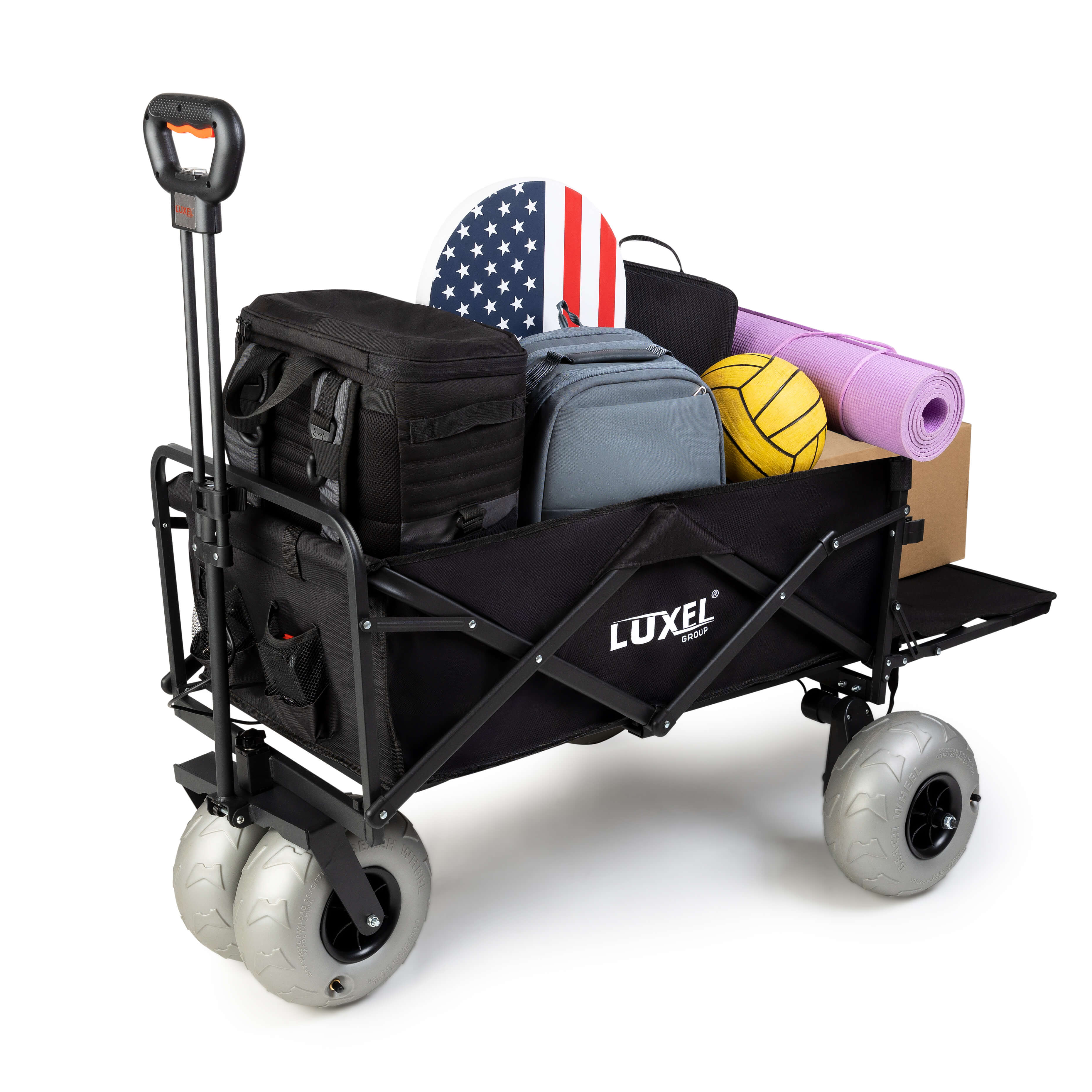 Luxel Group electric folding wagon with large gray beach wheels, fully loaded with bags, sports gear, and picnic items.
