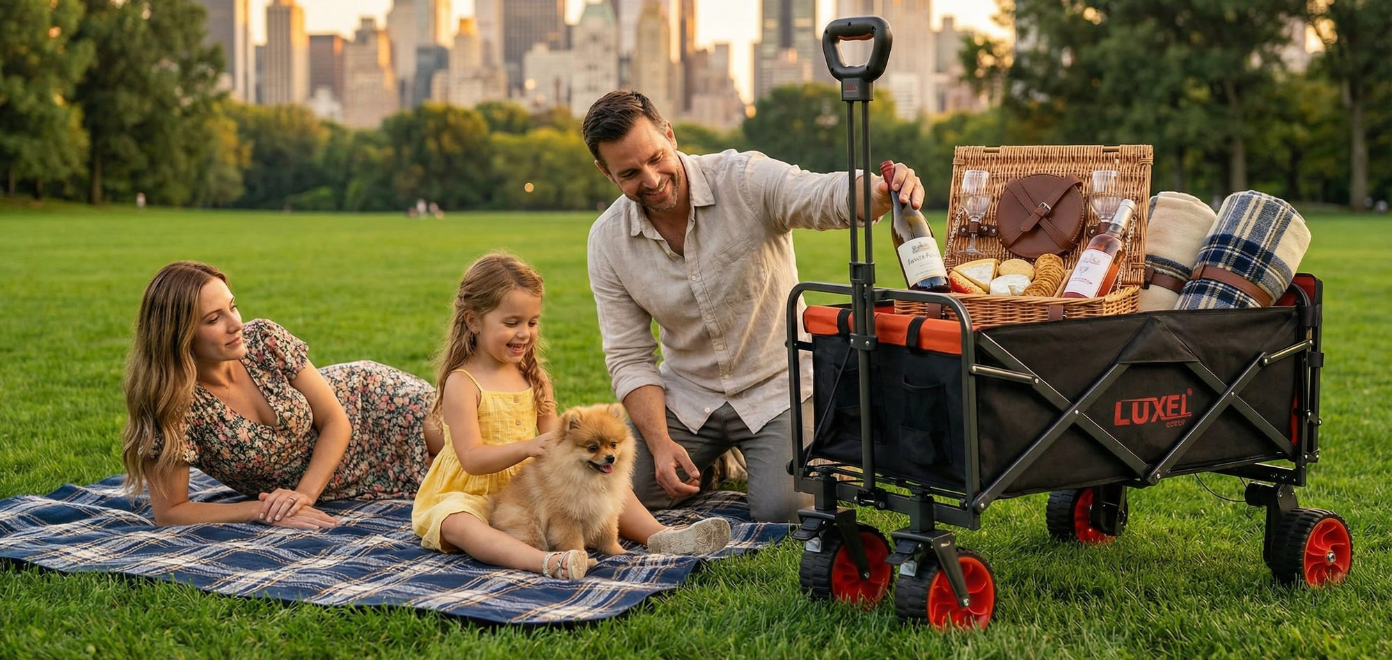 Family with a dog enjoying a picnic in a park with a LUXE wagon.