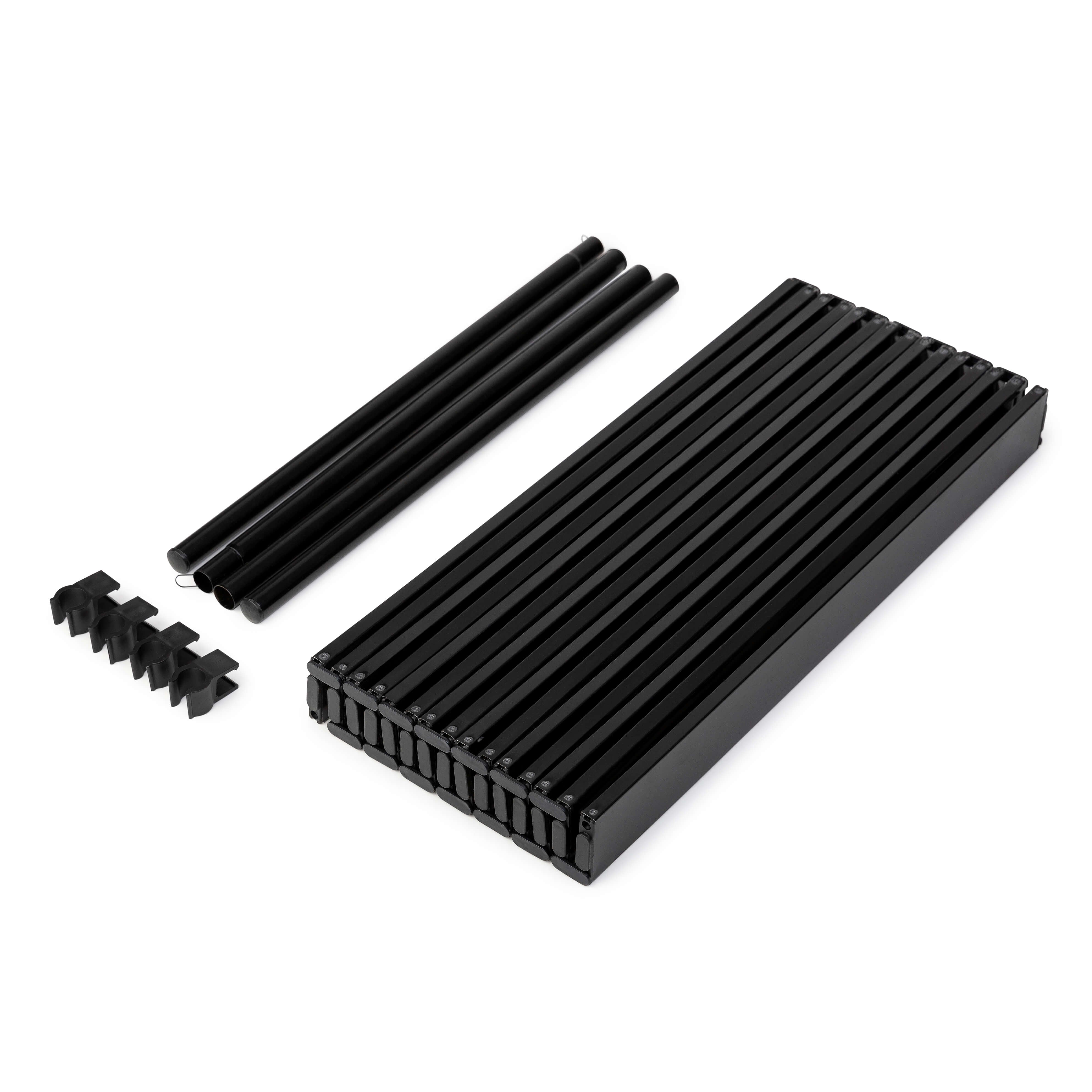 Disassembled black slatted tabletop parts for Luxel Group folding wagon, including poles and connectors.